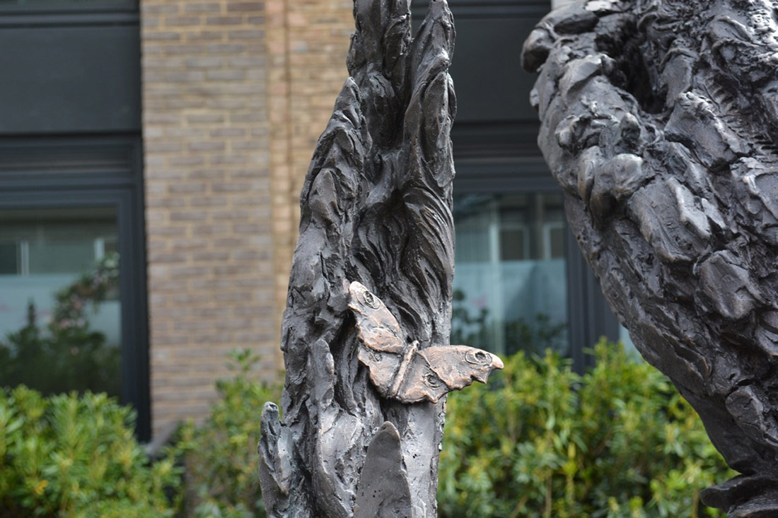 Butterfly detail spiral bronze sculpture